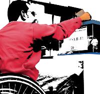 Un hombre en silla de ruedas introduce un voto en una urna